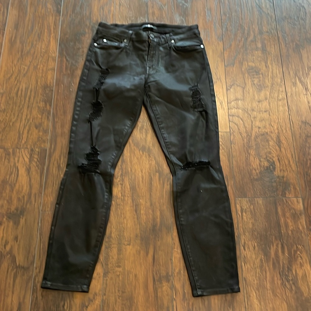 Seven for All Mankind black jeans with distressed tears and rips along leg